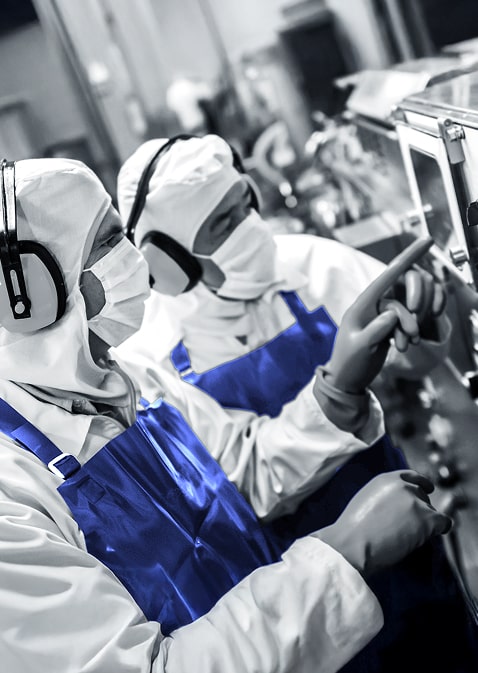 two people working with safety gear on